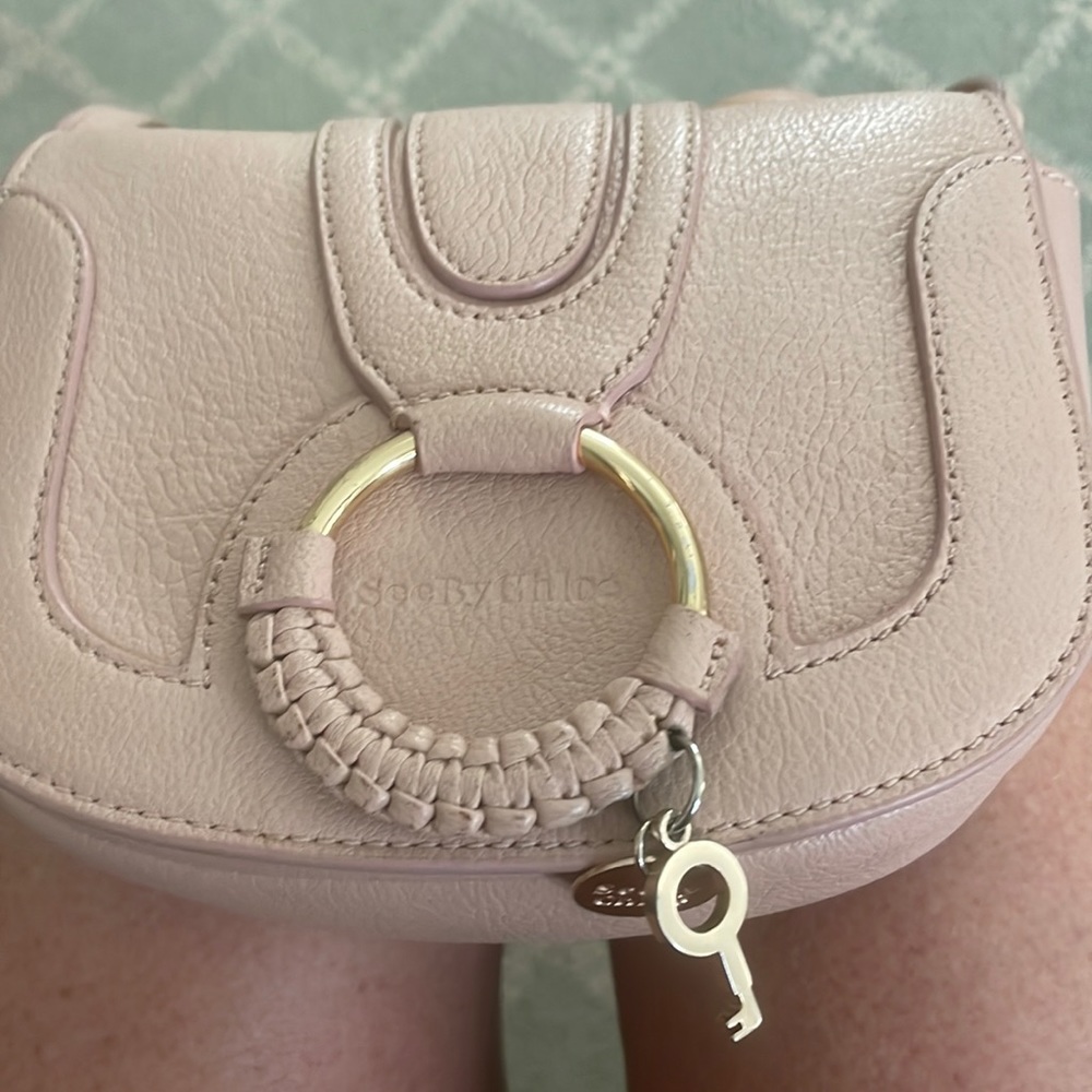 Light Pink see by Chloe cross body badly.